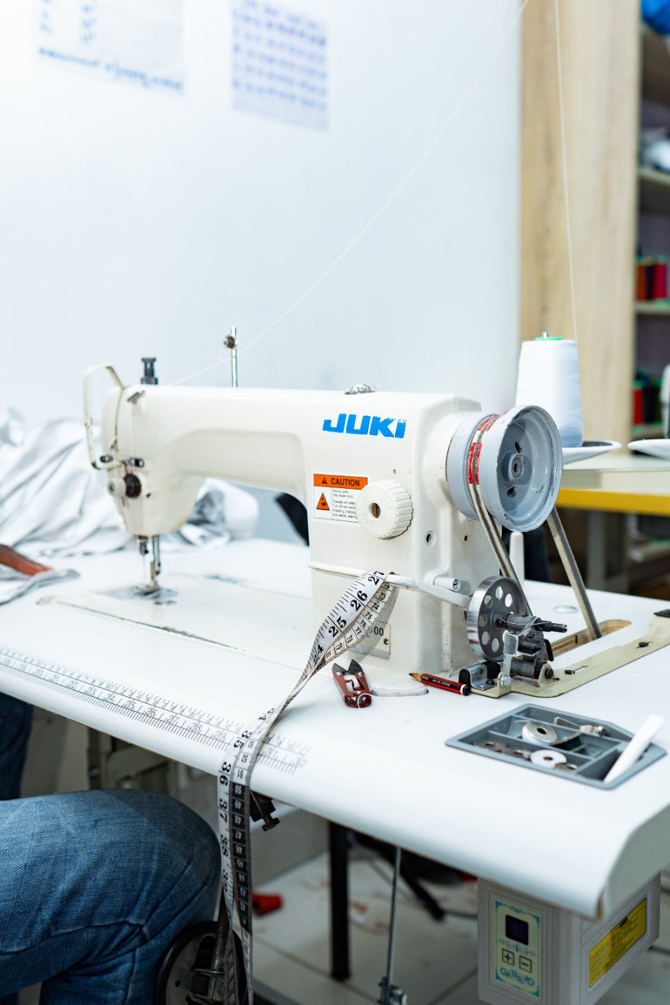 Juki sewing machine on a table with a blurred background